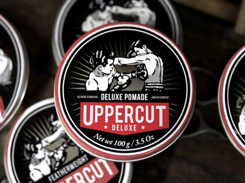 Uppercut Deluxe Pomade 100g front view of styling pomade tin with branding