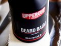 Uppercut Deluxe Beard Balm 100ml front view of beard styling balm tube with branding