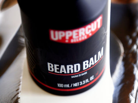 Uppercut Deluxe Beard Balm 100ml front view of beard styling balm tube with branding