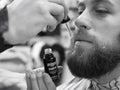 Uppercut Deluxe Beard Oil 30ml applied to beard showing groomed natural finish