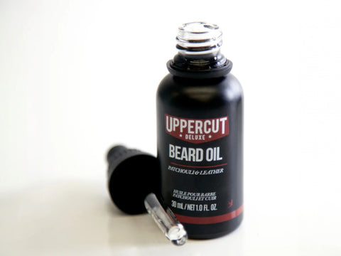 Uppercut Deluxe Beard Oil 30ml bottle angled view showing dropper cap and 30ml size