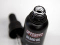 Uppercut Deluxe Beard Oil 30ml bottle angled view showing dropper cap and 30ml size