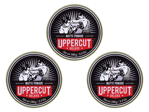 Uppercut Deluxe Matte Pomade 100g texture close up on finger showing medium hold matte finish styling product 3 packs