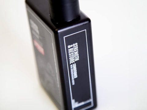 Uppercut Deluxe Strength and Restore Conditioner 240ml bottle angled view showing 240ml size