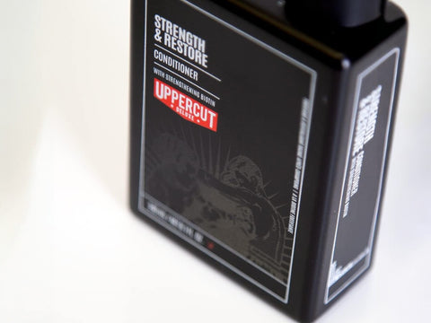 Uppercut Deluxe Strength and Restore Conditioner 240ml bottle angled view showing 240ml size