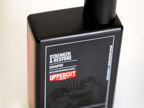 Uppercut Deluxe Strength and Restore Shampoo 240ml bottle angled view showing 240ml size