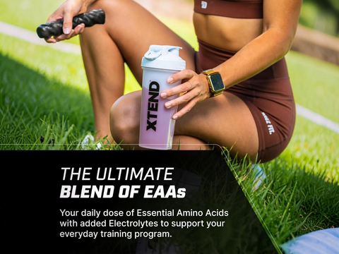 Person holding an Xtend protein shaker on grass with promotional text about EAA supplements.
