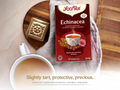Yogi Tea Echinacea box with a cup of tea on a wooden surface