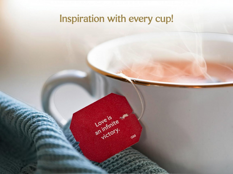 Tea cup with a red tag featuring a quote, blurred background