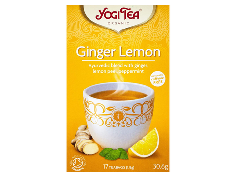 Yogi Tea Ginger Lemon package with a cup of tea and ingredients on a yellow background