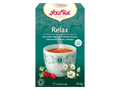 Yogi Tea Relax tea box with a cup of tea and tea leaves on a white background