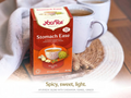 YogaTea Stomach Ease box with a cup of tea on a wooden surface