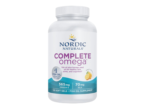 A white bottle of Nordic Naturals Complete Omega fish oil supplement with a white cap, featuring a label with blue and purple text and a small lemon graphic, on a plain white background.